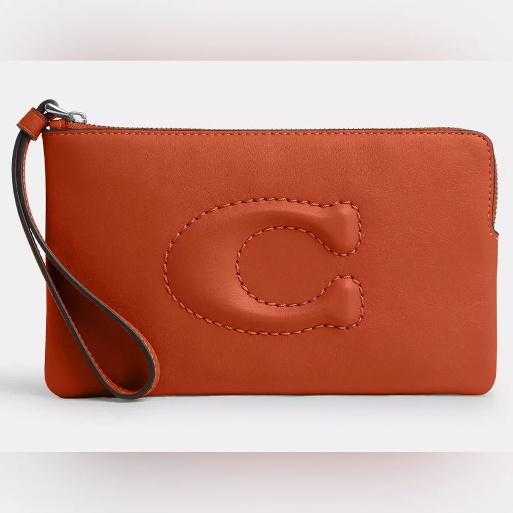 COACH Debossed Sculpted C Smooth Leather Large Corner Zip Wristlet inDark Orange